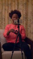 A Content Creator Actively Engaging with Their Audience via a Mobile Device in Various Ways video