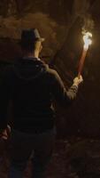 Embark on an exhilarating cavern exploration armed with just a torch to guide you through the dark video
