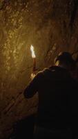 A Mysterious Figure Stands in a Dimly Lit Cave, Surrounded by Dark Shadows and Flickering Light video