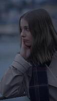 A Contemplative Woman by the Water at Dusk, capturing a serene moment of introspection video