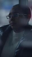 A contemplative individual enjoying the atmosphere in a modern urban setting, deep in thought video