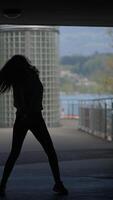 Exploring Dynamic Dance Moves Amidst a Vibrant Urban Setting Filled with Life and Energy video