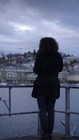 Contemplative Figure by the Water at Dusk, reflecting on life amidst the serene scenery video