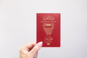 Passport Bahrain Held Against Simple White Background. Astana, Kazakhstan, 26 october 2024 photo