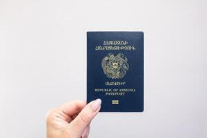 Armenia Passport Held Against Simple White Background. Astana, Kazakhstan, 26 october 2024 photo