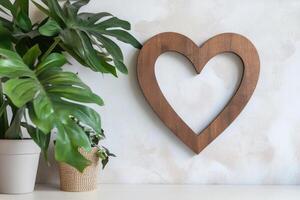 Photo frame of heart shape for mockup design on light wall background.