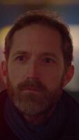 A Pensive Man Appears in a Dimly Lit Background, Evoking Contemplation and Depth video