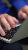 Focused Hands Efficiently Typing on a Laptop in a Modern and Sleek Workspace Environment video