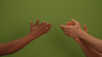 Clapping hands create a vibrant and lively atmosphere against a green background video