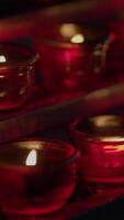 Beautiful Red Candles Gently Illuminating a Soft and Warm Glow in Any Space or Setting video