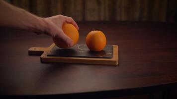 Citrus Fruits Being Skillfully Prepared on a Rustic Wooden Cutting Board for Cooking and Enjoyment video