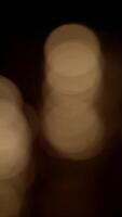 Glowing Circular Bokeh Lights Creating a Magical Atmosphere in the Embrace of Darkness video