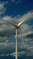 A Stunning Wind Turbine Standing Tall Against the Background of a Dramatic Cloudy Sky video