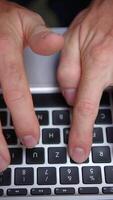 Hands are actively typing on a laptop keyboard within a modern and efficient workspace video