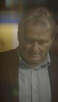 A man in profile at evening light shows his thoughts, blending elegance with seriousness video