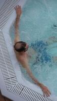 A Man Peacefully Relaxing and Unwinding in a Pool, Fully Enjoying a Moment of Leisure and Serenity video