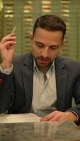 A Thoughtful Man Dressed in Business Attire Engaging in Deep Reflection and Contemplation video