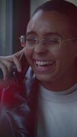 A Joyful Conversation A Smiling Person Engaged in a Phone Call with Enthusiasm and Cheer video