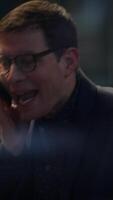 Engaged in a lively conversation while wearing stylish glasses, creating a vibrant atmosphere video
