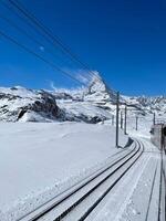 Stunning view of the Matterhorn peak on the train and glacier in Zermatt. photo