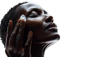 Moisturizing skincare routine with woman applying cream on her face photo