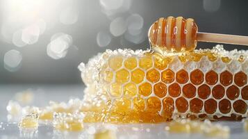 Honeycomb with honey dipper, golden sweetness dripping, natural delight photo