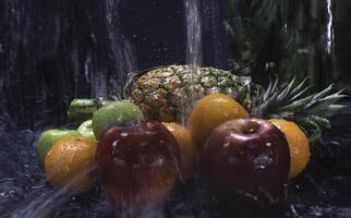 Mixed fruit.there are Pineapple,Apple and orange put on background photo