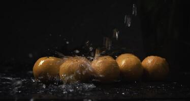 Orange fruit was wet with water splash, photo