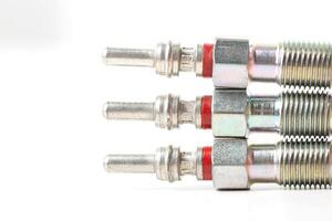 Modern ceramic glow plugs for warming up a diesel engine before starting. White background, isolate. Macro photo