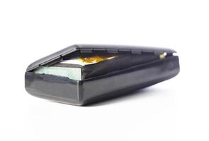 Bloated black power bank on a white background, isolate. Danger of power bank explosion, close-up photo