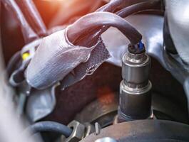 Automotive sensor lambda probe in a diesel engine. Measuring oxygen content in car exhaust gases, macro photo