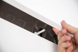 Modern push to open mechanism with magnetic tip, macro photo