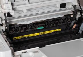 Toner cartridge in a laser printer. Servicing and Troubleshooting the Laser Printer. Close-up photo