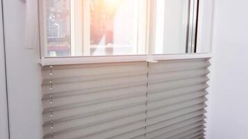 Modern classic aluminum blinds on the window sash with a scaffold fixing system. Protection from prying eyes and the sun. photo