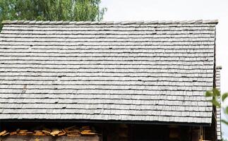 shingle roof. Old method of making roofs from wood, background. Copy space for text photo