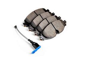 Set of brake pads with a wear indicator on a white background, isolate. Wear sensor for brake pads photo