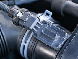 Automotive air flow sensor, close-up. Measures the amount of air entering the engine and sends it to the electronic control unit. Diesel engine photo