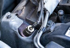 Automotive sensor lambda probe in a diesel engine. Measuring oxygen content in car exhaust gases, macro photo