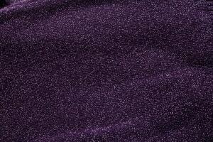 purple sweater with sequins, background, macro. Texture photo
