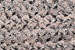 Gray pleated material, background. Macro, textured. Wrinkled photo