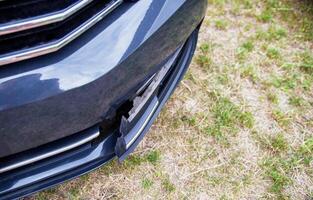 Disassembling and removing the fog lamp from a car to replace a burnt out light bulb. Close-up photo