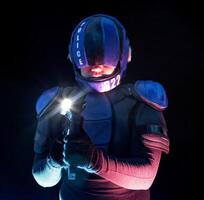 Cyberpunk future concept. Police officer cop, halfman aims around in dar. Bionic cyborg robot is in fume, smoke. Weapon gun with lantern. Science fiction scene, fantasy, sci. photo