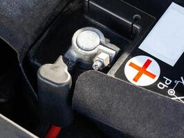 Positive terminal of the car battery, macro. 12v, photo