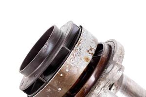 Corrosion and sinkholes on a spent car pump out of order, on a white background, isolate. photo