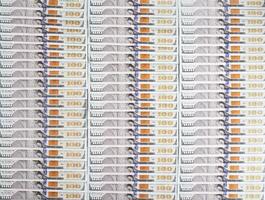 Lots of 100 us dollar banknotes, background. Business and currency exchange concept, copy space for text photo