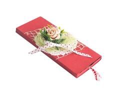Beautiful gift envelope with artificial flower on a white background, isolate. Festive money envelope, traditional photo