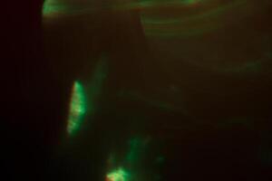 Blurred lens flare. Defocused colorful lights. Shiny glowing spots, abstract background and texture photo