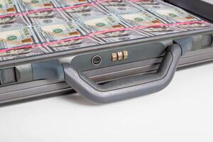 Case with money bills of 100 dollars on a white background. Wealth, financial investment and investment concept, copy space for text. Criminal photo