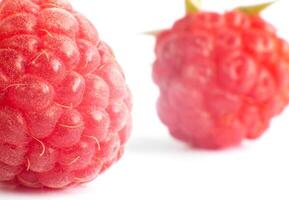 Juicy raspberry berry on a white background, isolate, macro photo