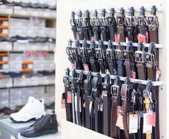 A shop specializing in the sale of quality leather belts and belts. Fashionable and stylish belts, background photo